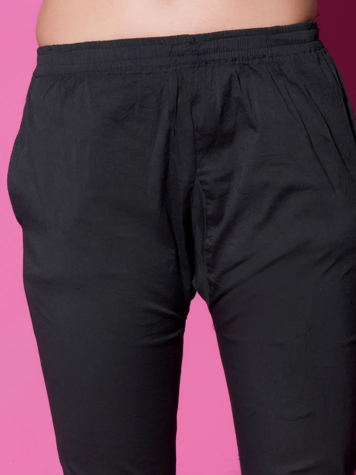 Black pants on a pink background