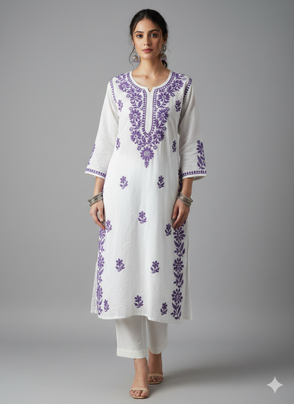 Woman wearing a white kurta with purple embroidery on a gray background